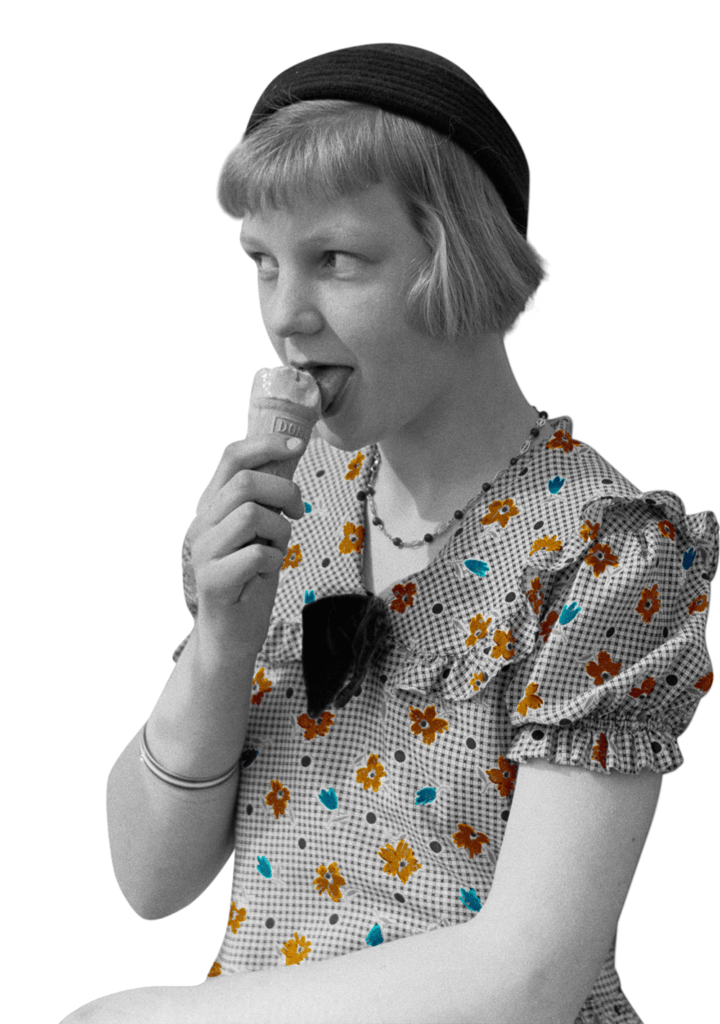 1930s girl in a beret and floral dress licking an ice cream. The girl is amused by something in the distance. 