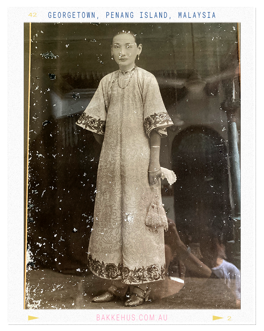 Vintage portrait photograph of Cheong Fatt Tze’s seventh wife, dressed in an ornate traditional Chinese outfit with embroidered detailing and accessories, displayed at the Blue Mansion in George Town, Penang, Malaysia. A glimpse into the personal history and style of the mansion’s former residents. © Heidi Isaksen-Loxton for bakkehus.com