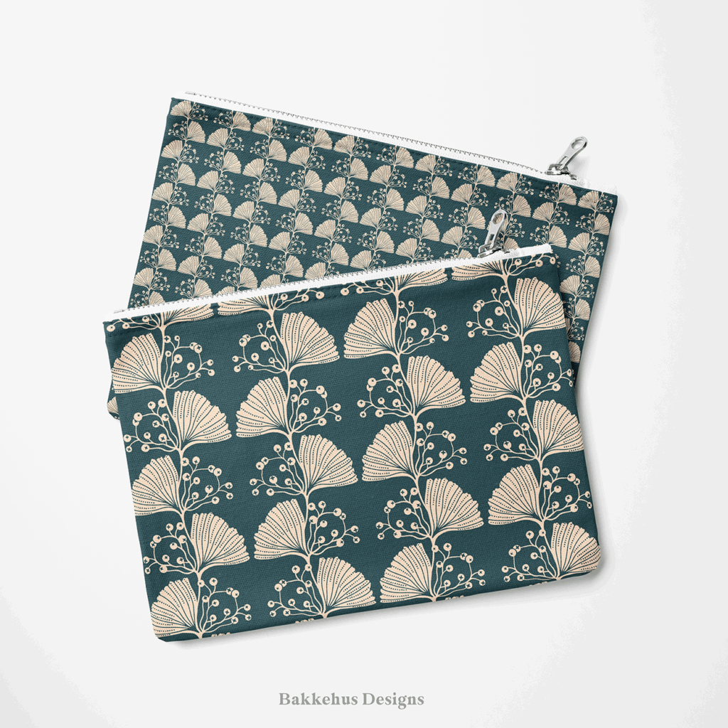 Two zip pouches made from Art Nouveau Ginkgo Sprig fabric, one lying on the other, printed with stylised cream ginkgo leaves and berry sprigs on deep teal.