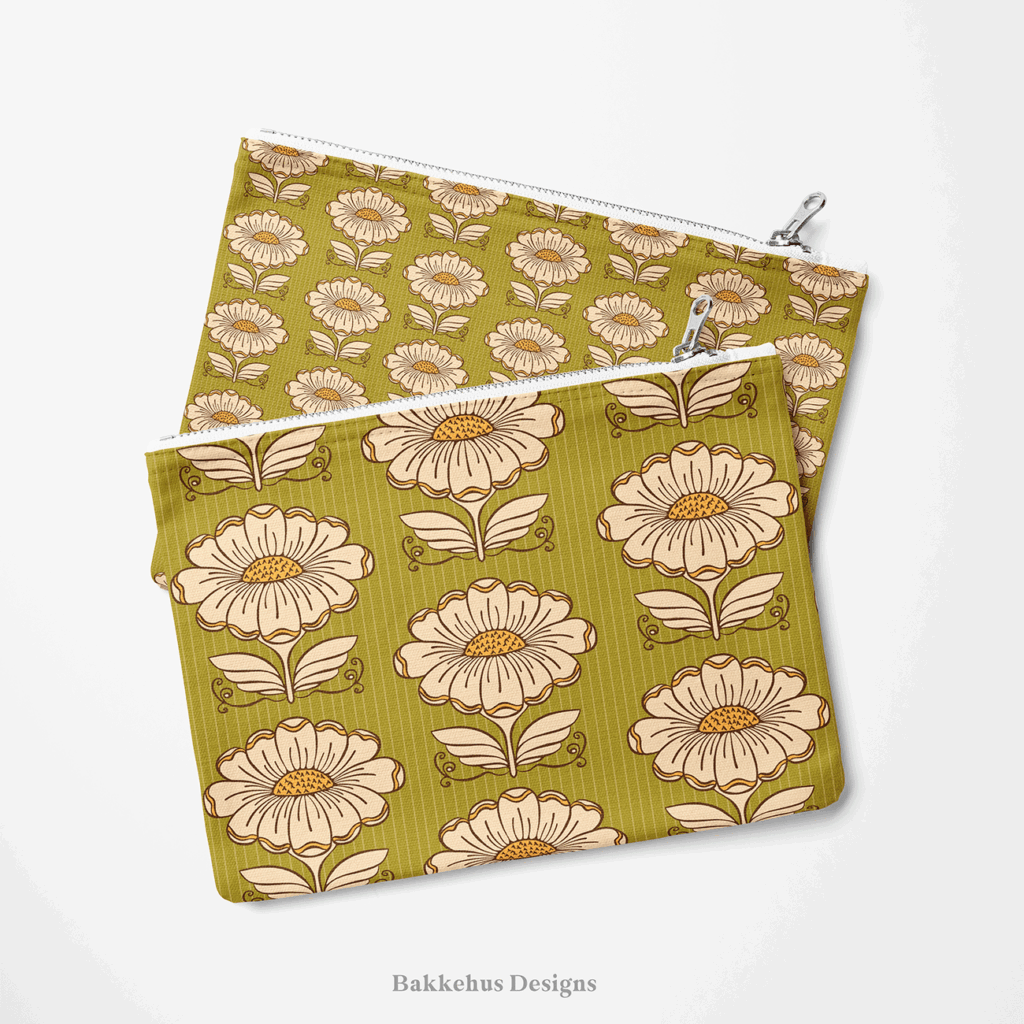 Two zip pouches made from Hillside Bloom fabric, one lying on the other, printed with cream daisies and stylised leaves on olive green.