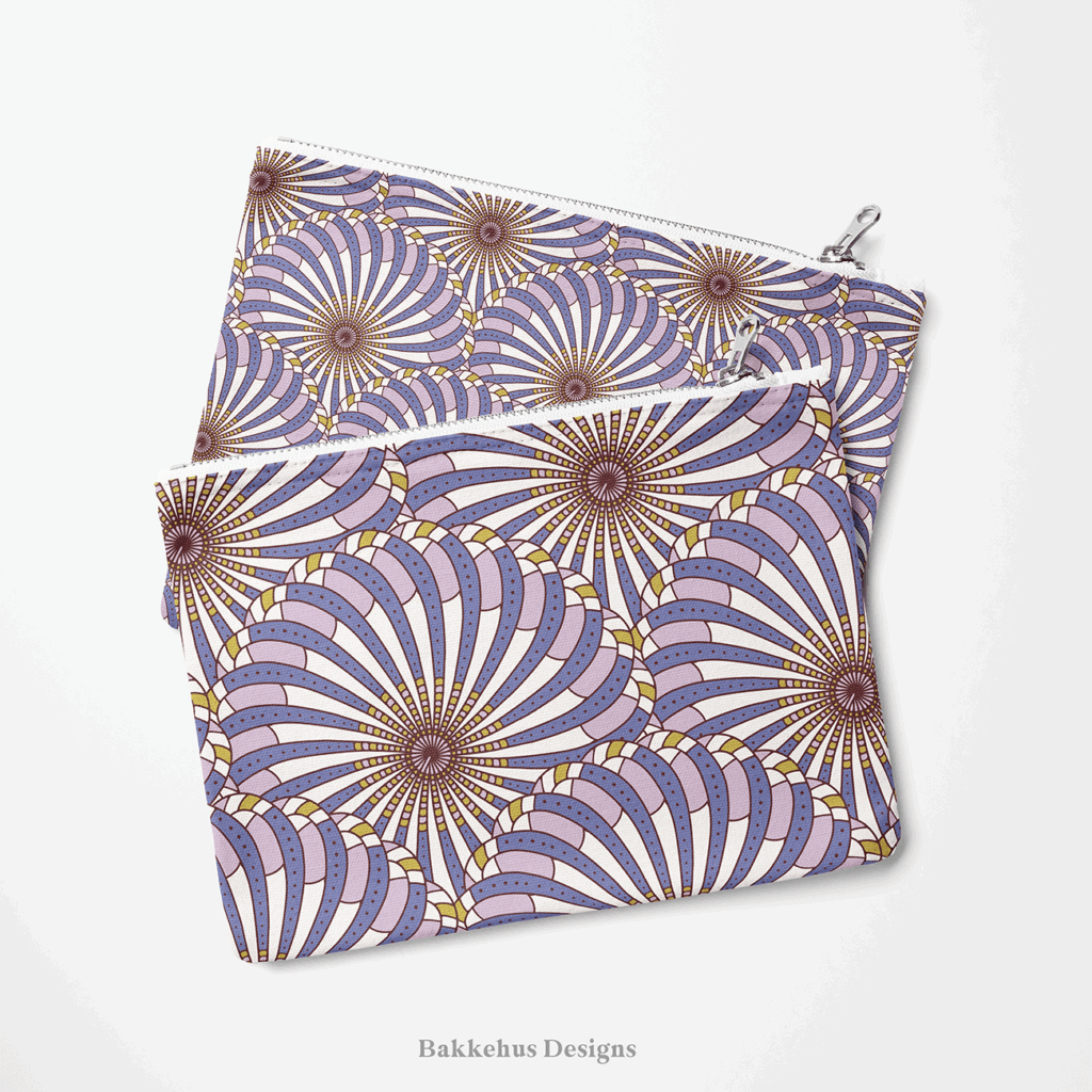 Two zip pouches made from Retro Gatsby Disco fabric, one lying on the other, printed with Art Deco scallop fans in cornflower blue and lilac.