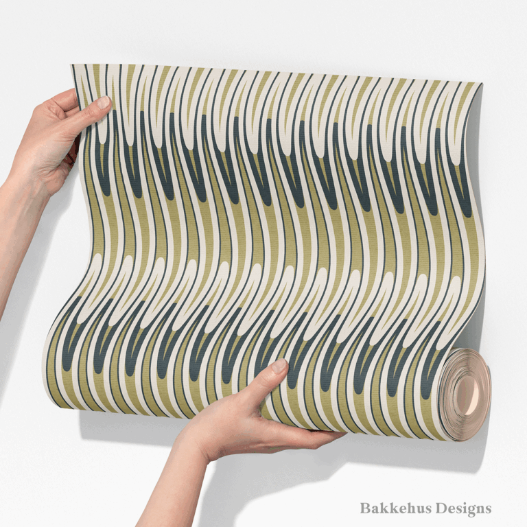 Two hands unroll a length of Retro Wavy Stripe wallpaper, showing the elongated olive green and charcoal waves running in vertical stripes on cream.