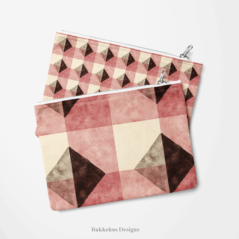 Two zip pouches made from Textured Brown Diamond Check fabric, one lying on the other, printed with deep brown diamonds and clay-rose blocks on cream.