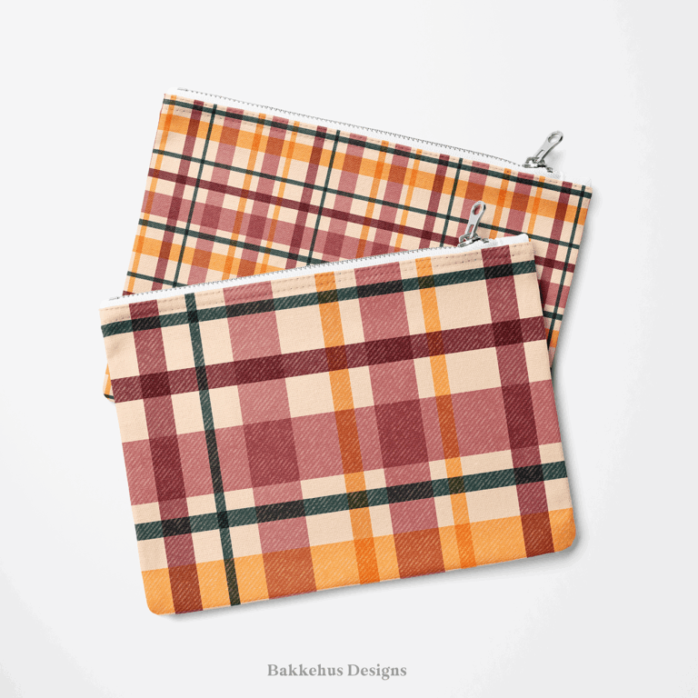 Two zip pouches made from Textured Windowpane Plaid fabric, one lying on the other, printed with a teal, burgundy, mauve and burnt orange retro plaid.