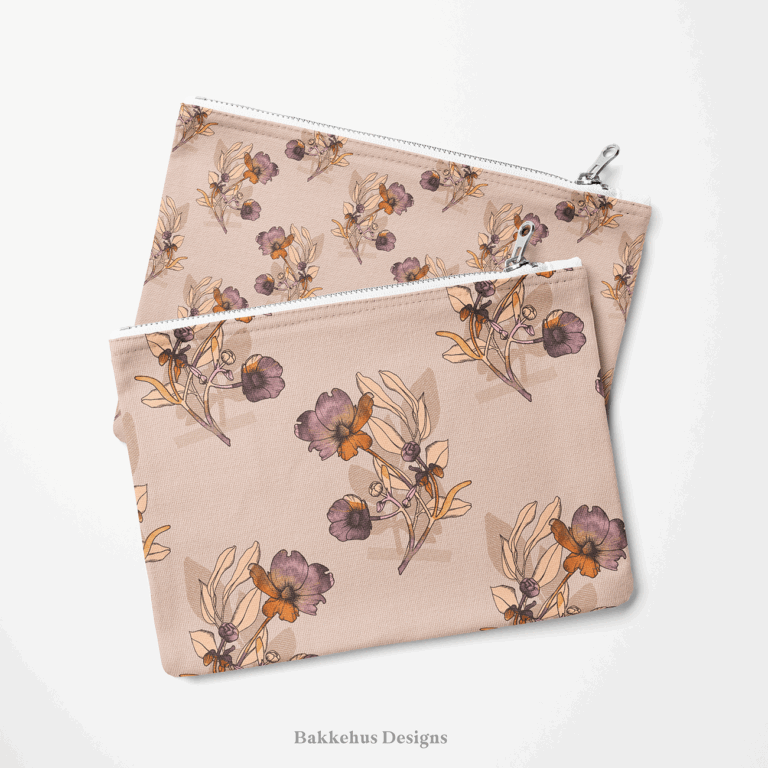 Two zip pouches made from Vintage Buttercup Floral fabric, one lying on the other, printed with hand-drawn ranunculus sprigs in mauve, plum and rust on blush.